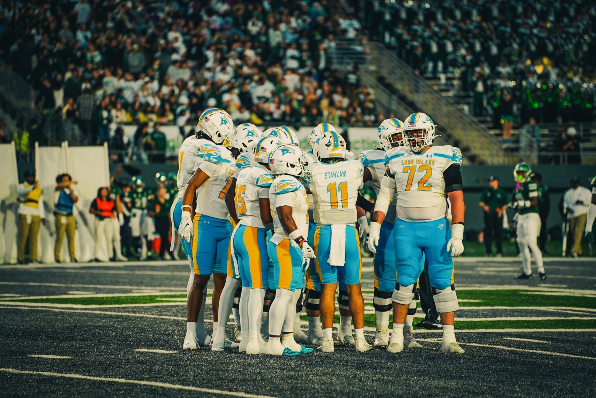 Sharks offense huddle on the road